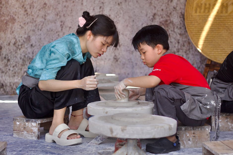 Young individuals actively participating in hands-on pottery class, exploring traditional craftsmanship.